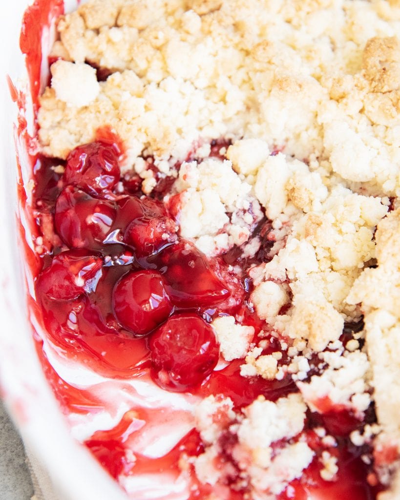 A cake mix cherry cobbler in a baking pan.