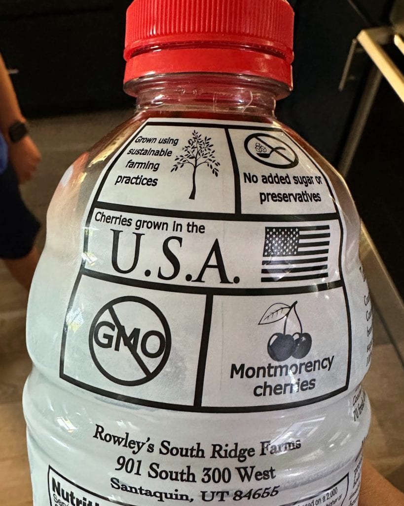 A close up of a bottle of cherry juice concentrate showing the USA grown label.