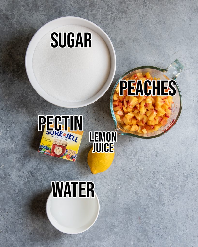 An overhead photo of the ingredients needed to make peach freezer jam.