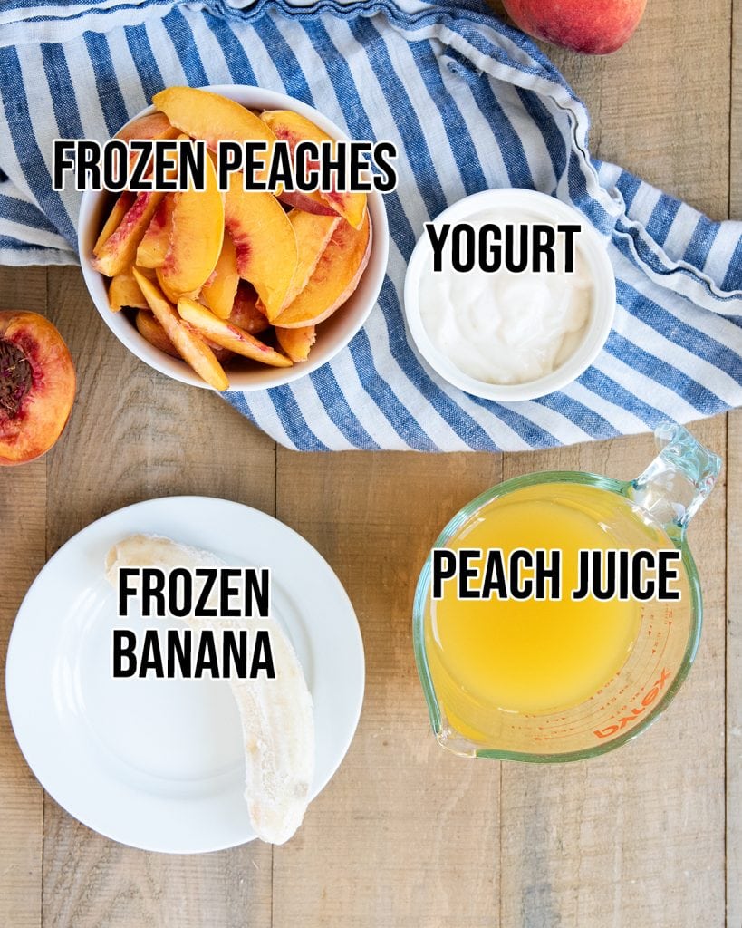 An overhead photo of the 4 ingredients needed to make a peach smoothie.