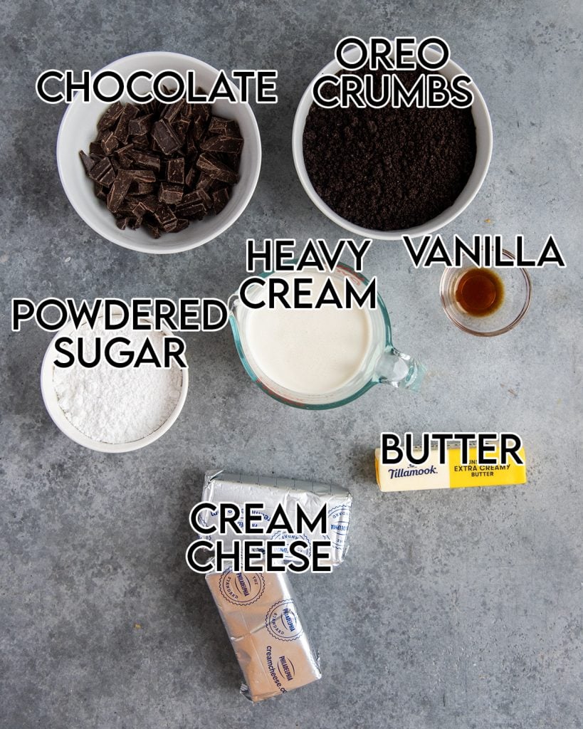 An overhead photo of the ingredients needed to make a no bake chocolate cheesecake with an oreo crust.