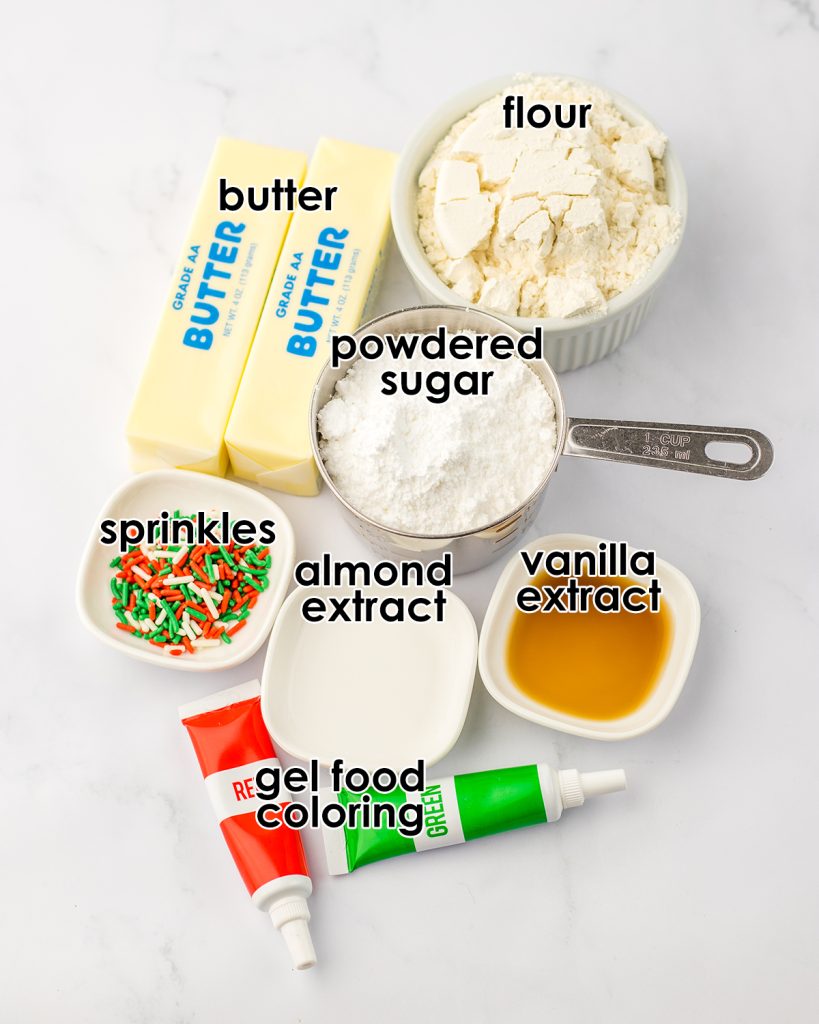 An overhead photo of the ingredients needed to make Christmas shortbread cookie bites with labels on them.