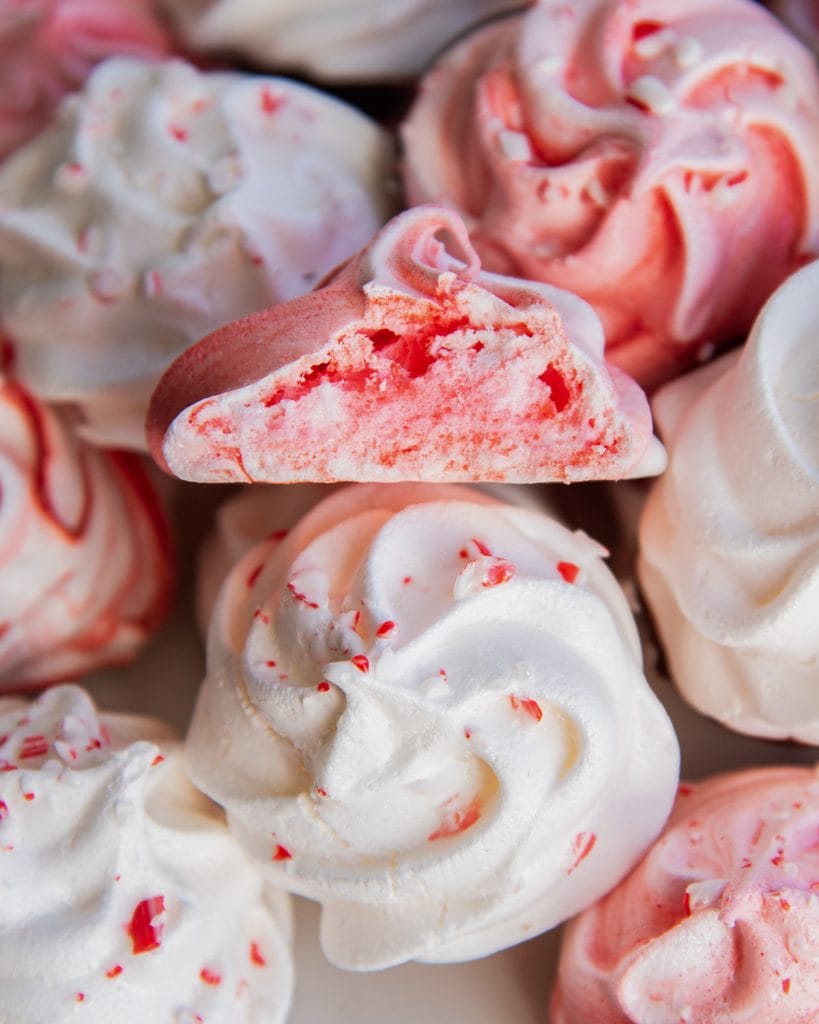 A meringue cookie, cut in half to show the middle of the cookie.