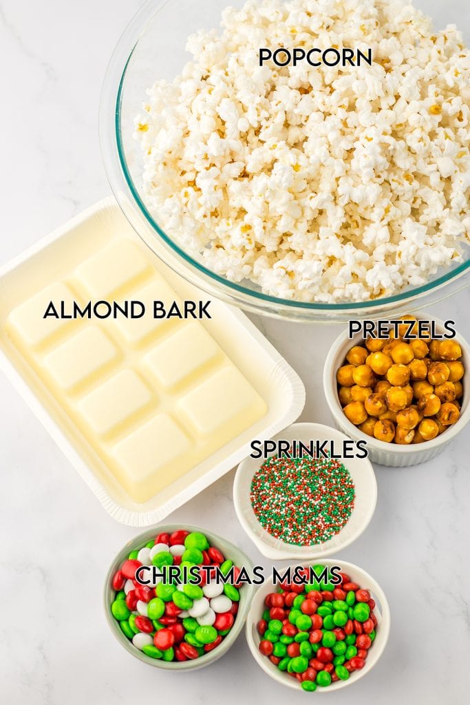 The ingredients needed to make white chocolate Christmas popcorn.