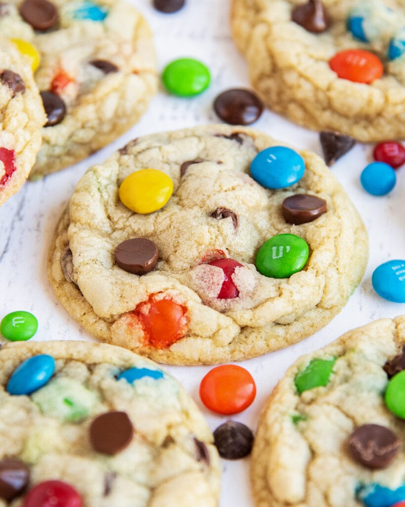 A M&M cookie topped with m&ms and chocolate chips.