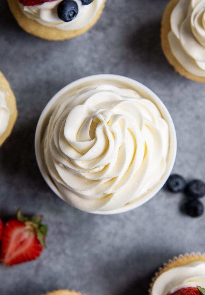 An overhead photo of a bowl of whipped cream cheese frosting.