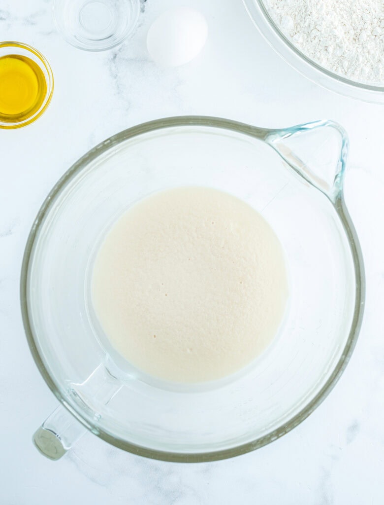 A glass bowl of yeast and water.