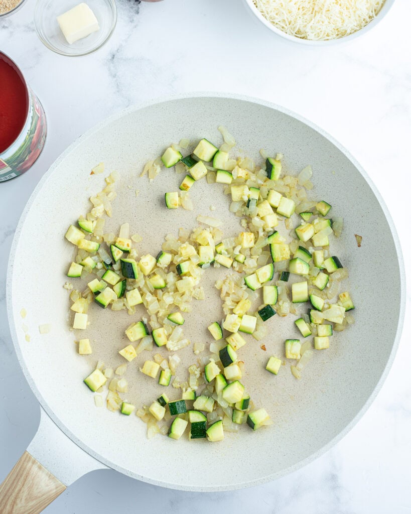 A pan of sauteed zucchini and garlic.