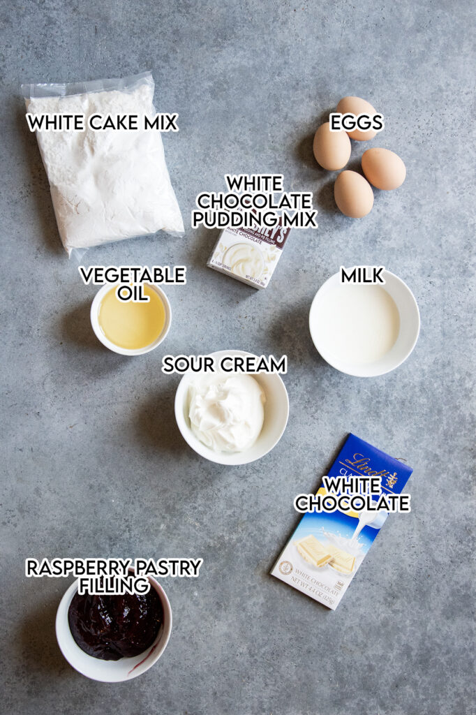 An overhead photo of the ingredients needed to make white chocolate raspberry bundt cake. 