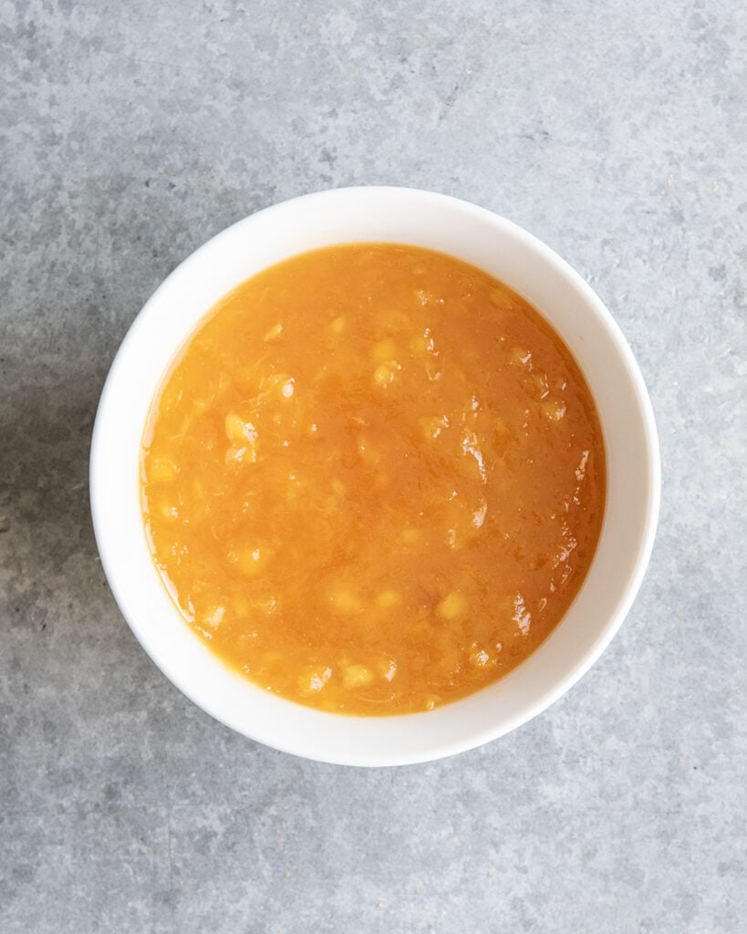 A bowl of peach puree. 