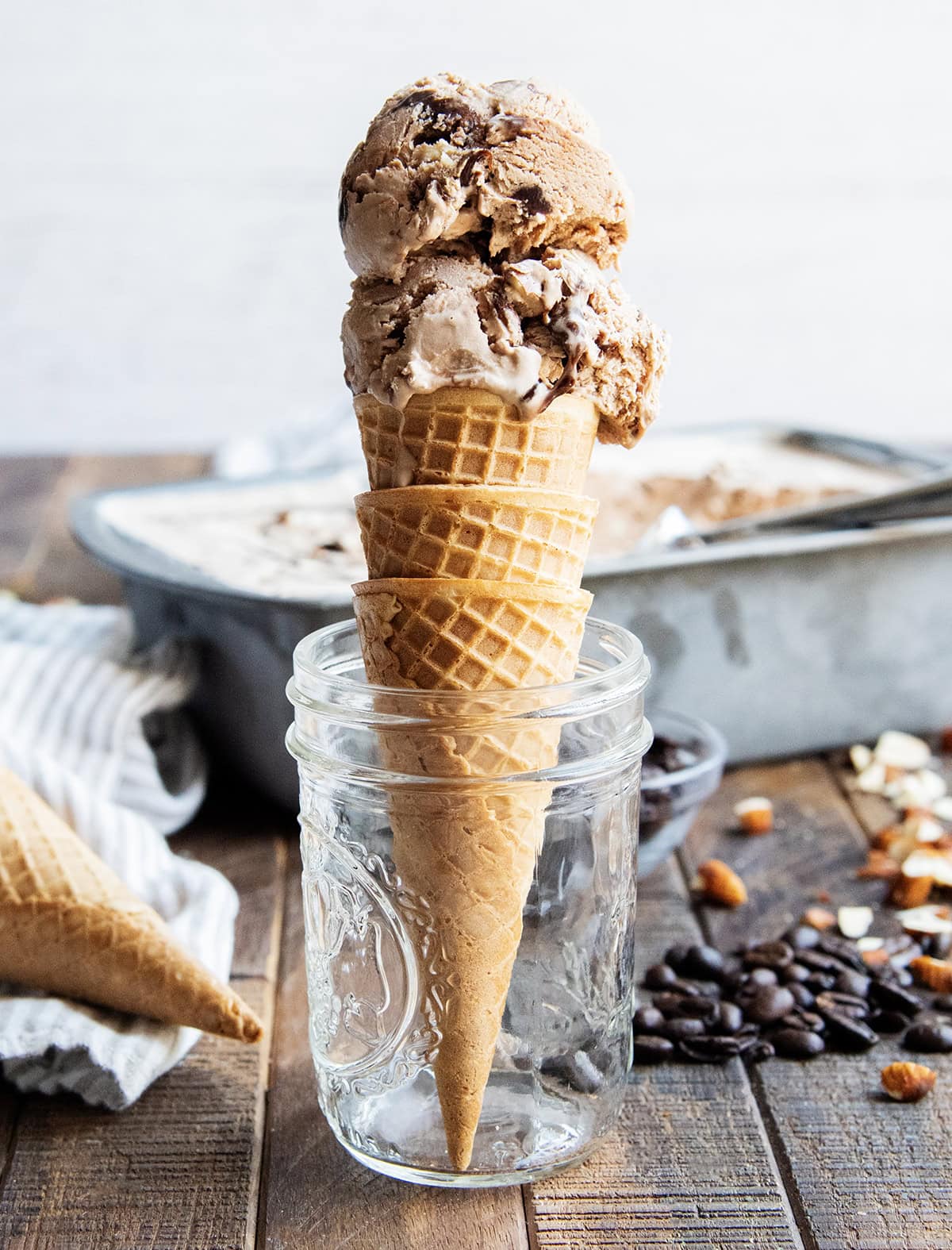 A chocolate ice cream cone set in a glass jar.