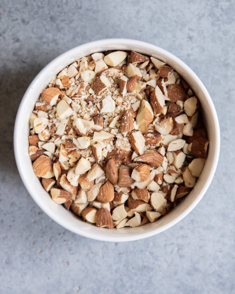 A bowl of chopped toasted almonds.