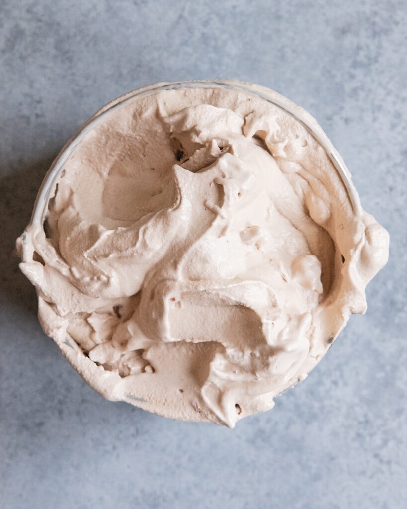 A chocolatey ice cream churned in an ice cream maker.