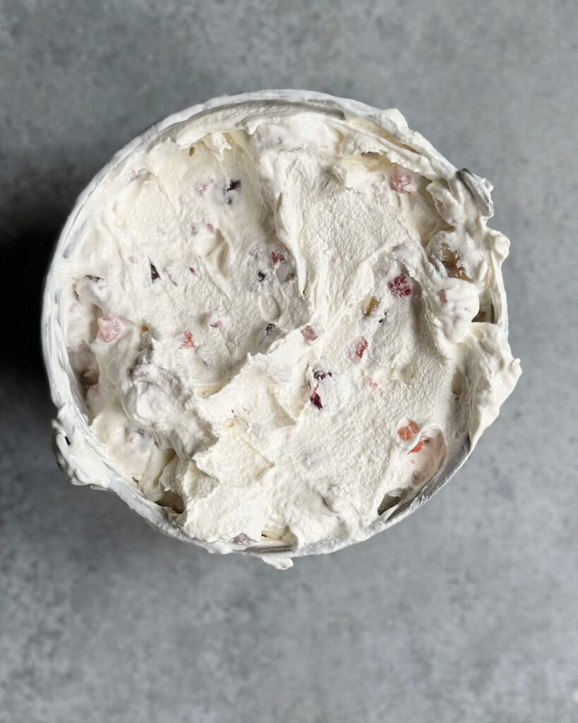Churned tutti frutti ice cream in an ice cream maker.