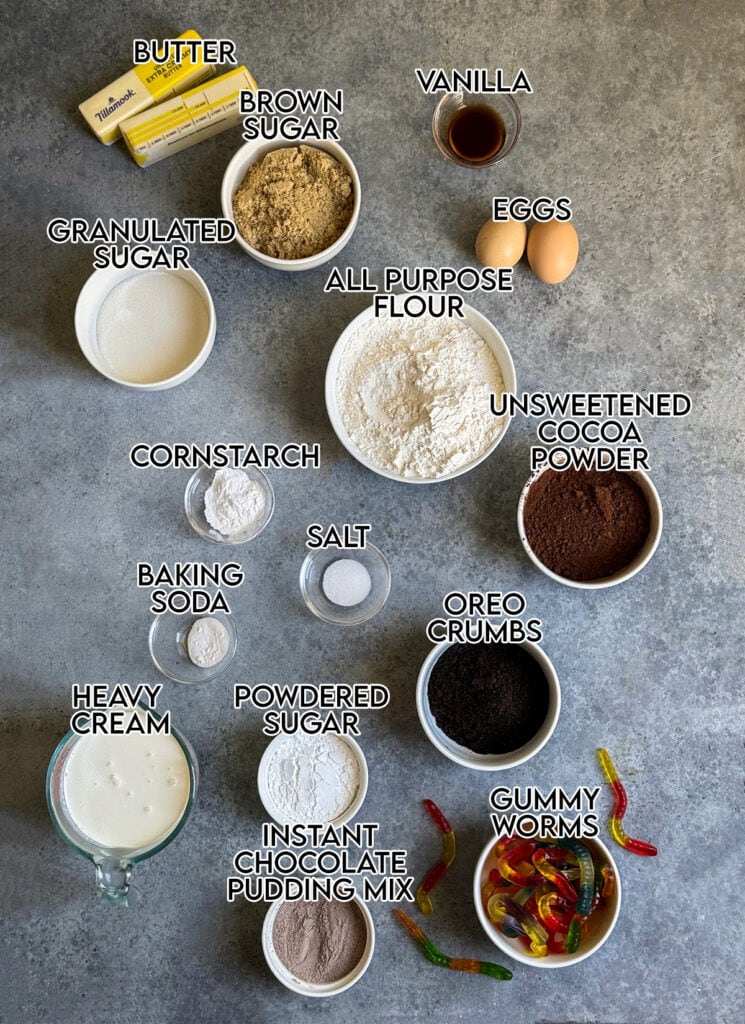 The ingredients needed to make chocolate cake cookies in small bowls. 