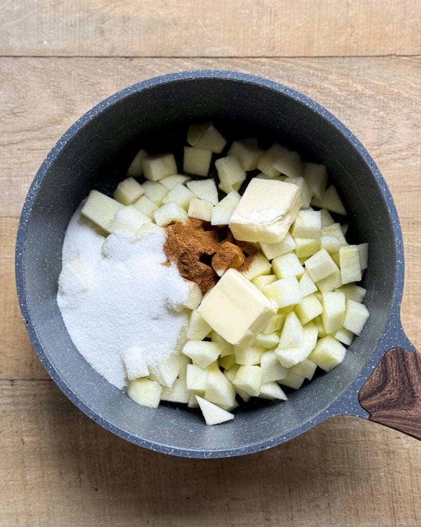A pot of apple pie egg roll ingredients, not mixed. 