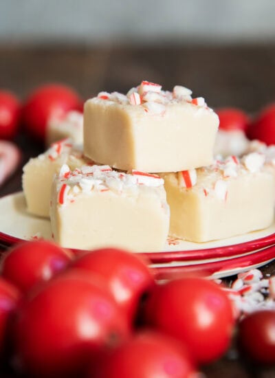 A small plate with a pile of white chocolate peppermint fudge.