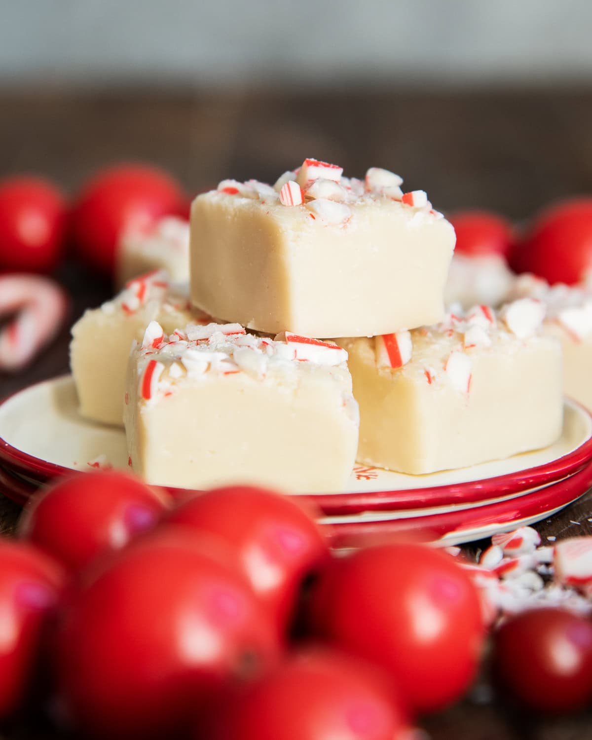 A small plate with a pile of white chocolate peppermint fudge.