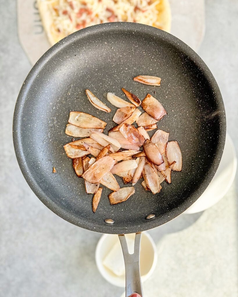 A pan of sauteed shallots.