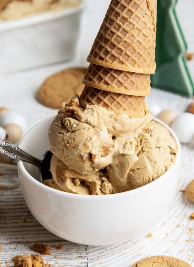 A big bowl full of gingerbread cookie ice cream, topped with upside down ice cream cones.
