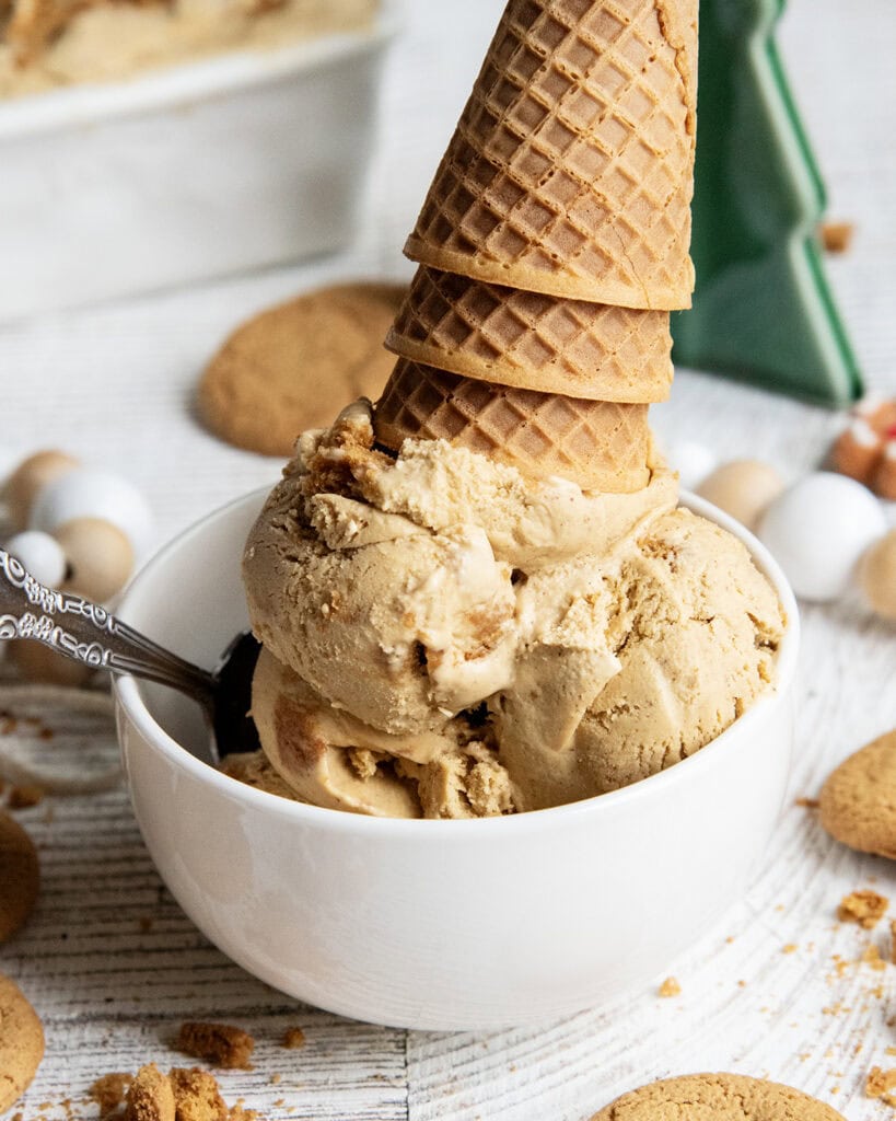 A big bowl full of gingerbread cookie ice cream, topped with upside down ice cream cones. 