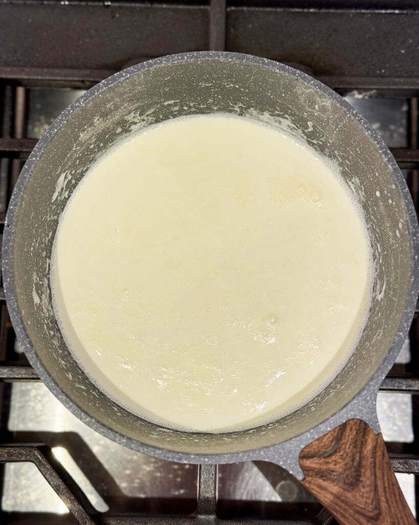 Custard base cooking in a pot. 