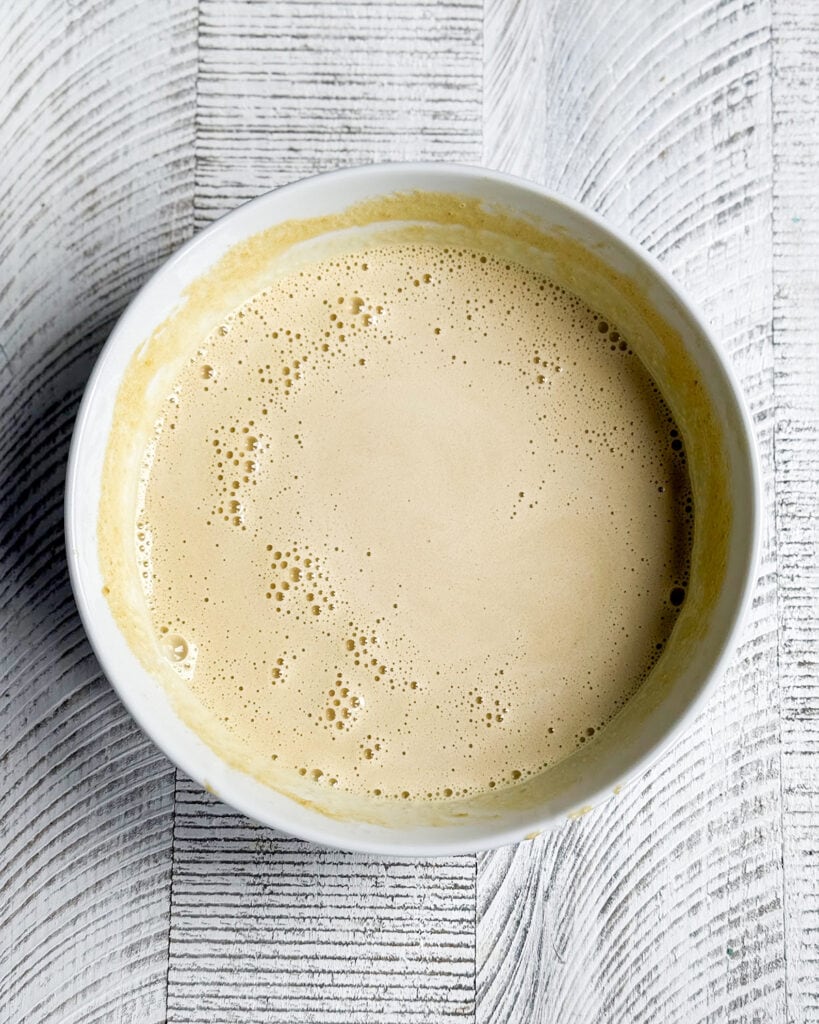 A gingerbread ice cream custard base in a bowl.