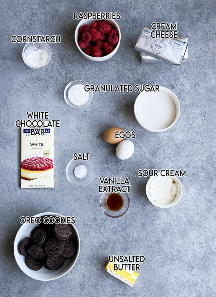 An above view of the ingredients needed to make white chocolate raspberry cheesecake bars. 