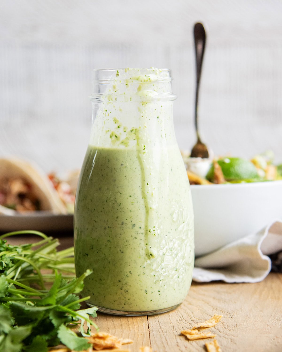 A bottle of a green tomatillo and cilantro ranch dressing.