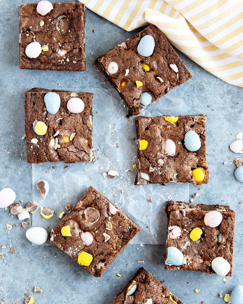 An above view of square Cadbury Egg Brownie pieces.