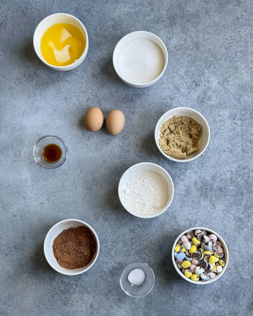 Small bowls of the ingredients needed to make cadbury mini eggs. 