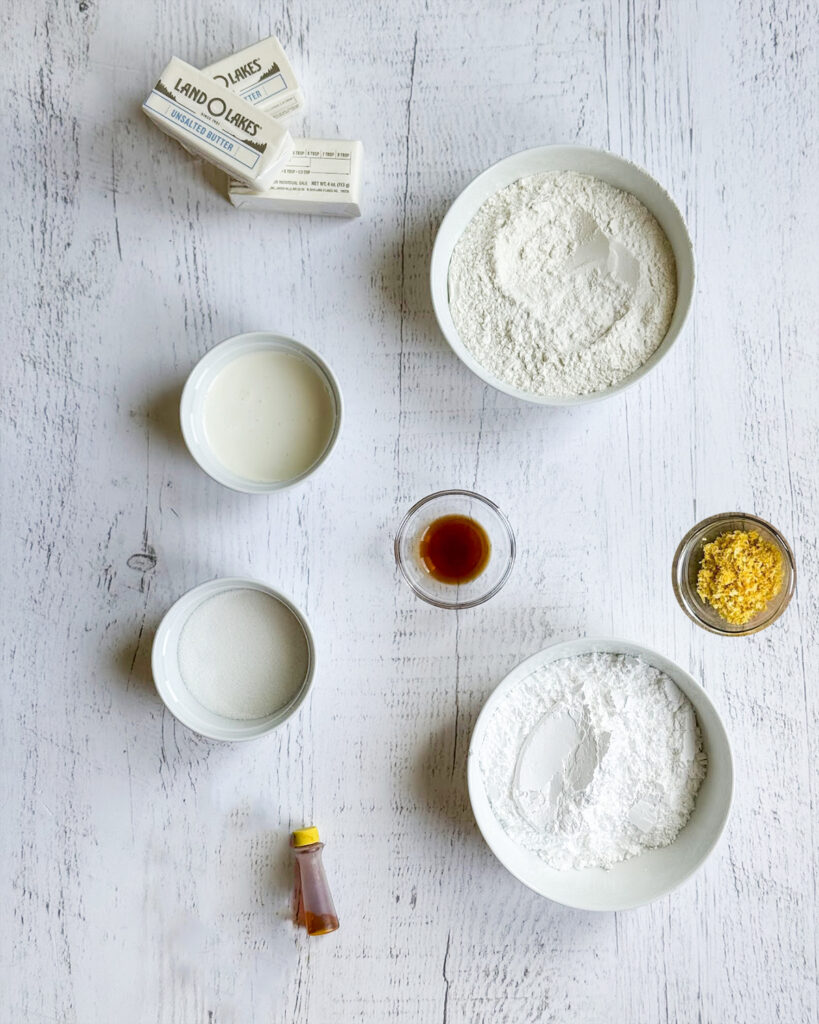 Small bowls of the ingredients needed to make lemon cream wafers.