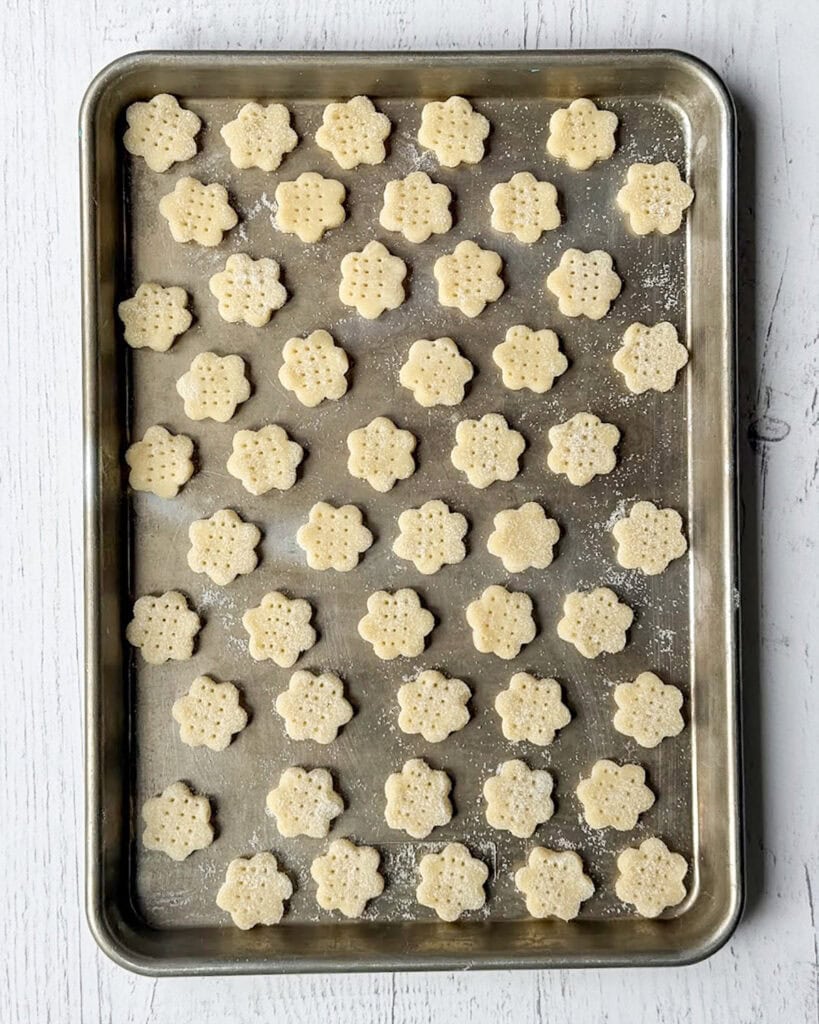 Lemon Cream Wafer cookie cut outs on a baking sheet.