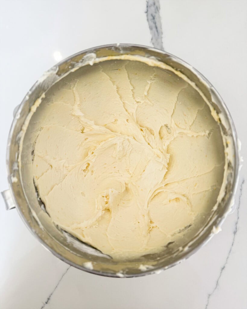 A bowl of whipped lemon frosting.