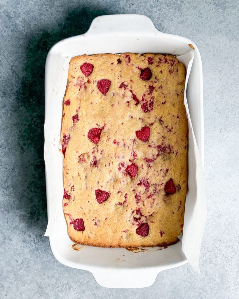 Baked Raspberry lemon blondies in a white pan.
