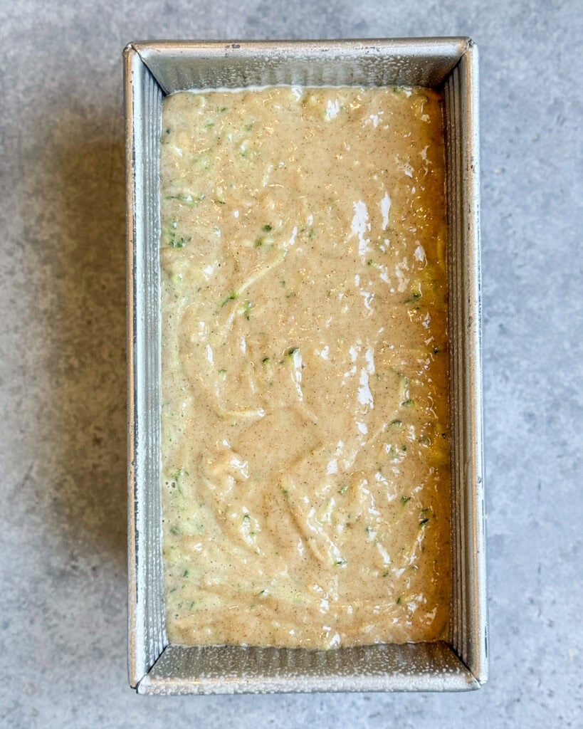 Zucchini banana bread batter in a bread pan.