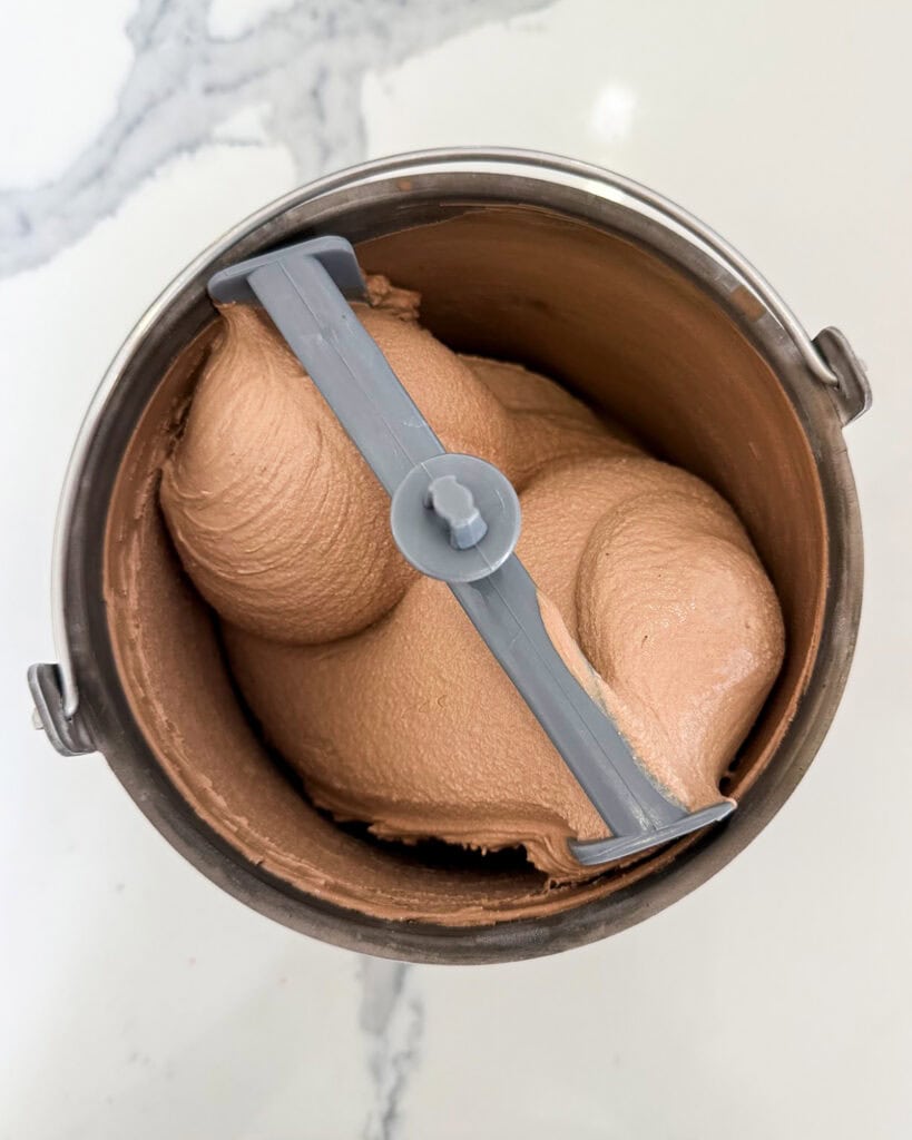 Chocolate Ice cream churned in an ice cream amker.