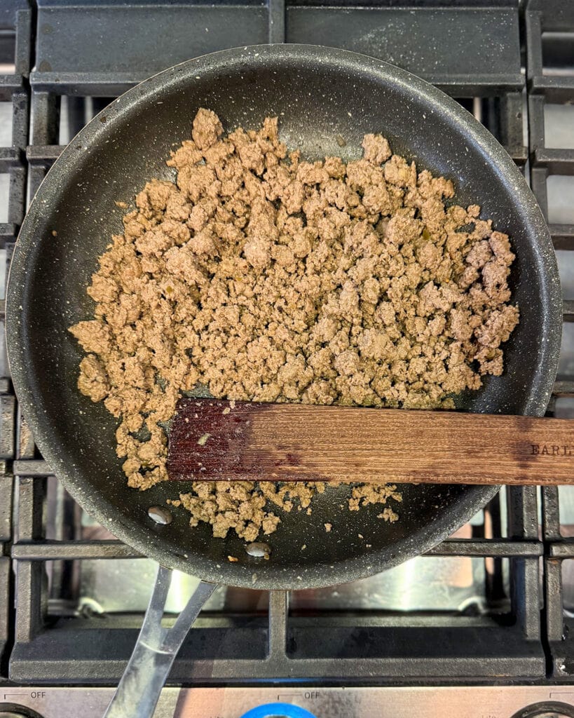 Cooked ground beef in a skillet.