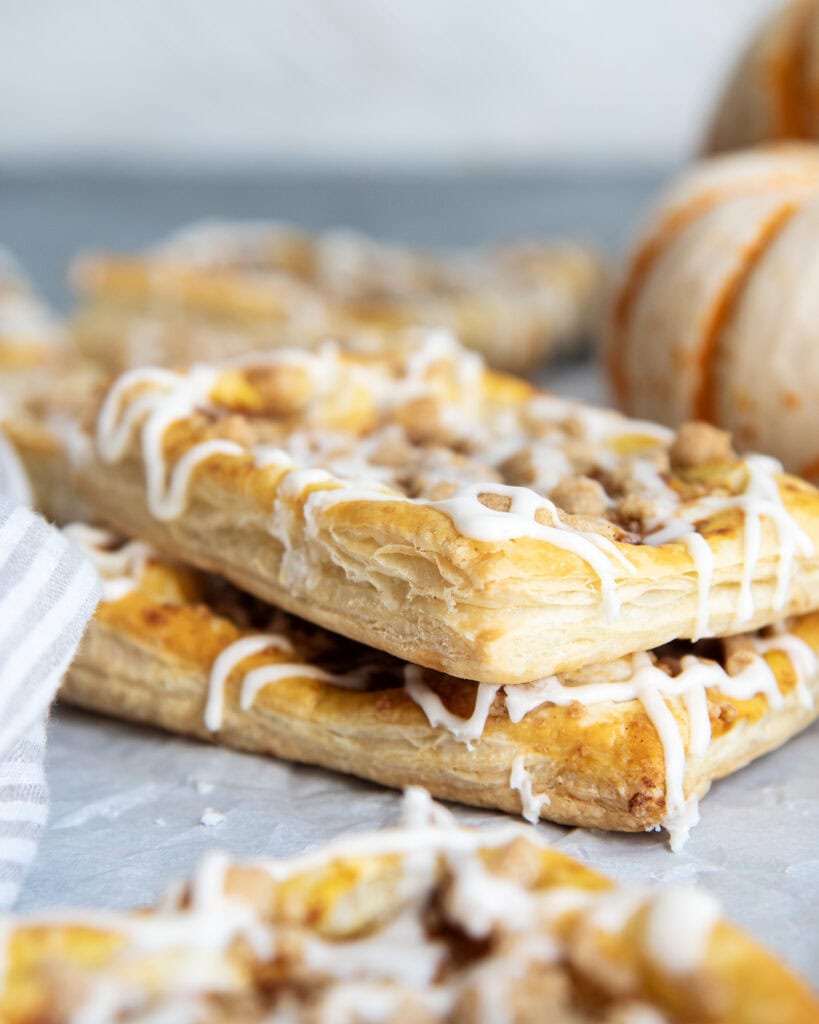 A stack of two pumpkin danishes.