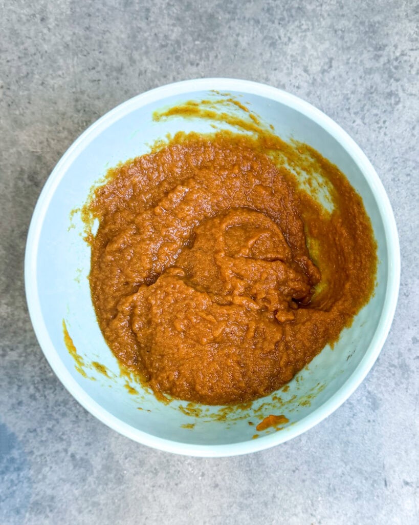 A bowl of an orange pumpkin mixture.