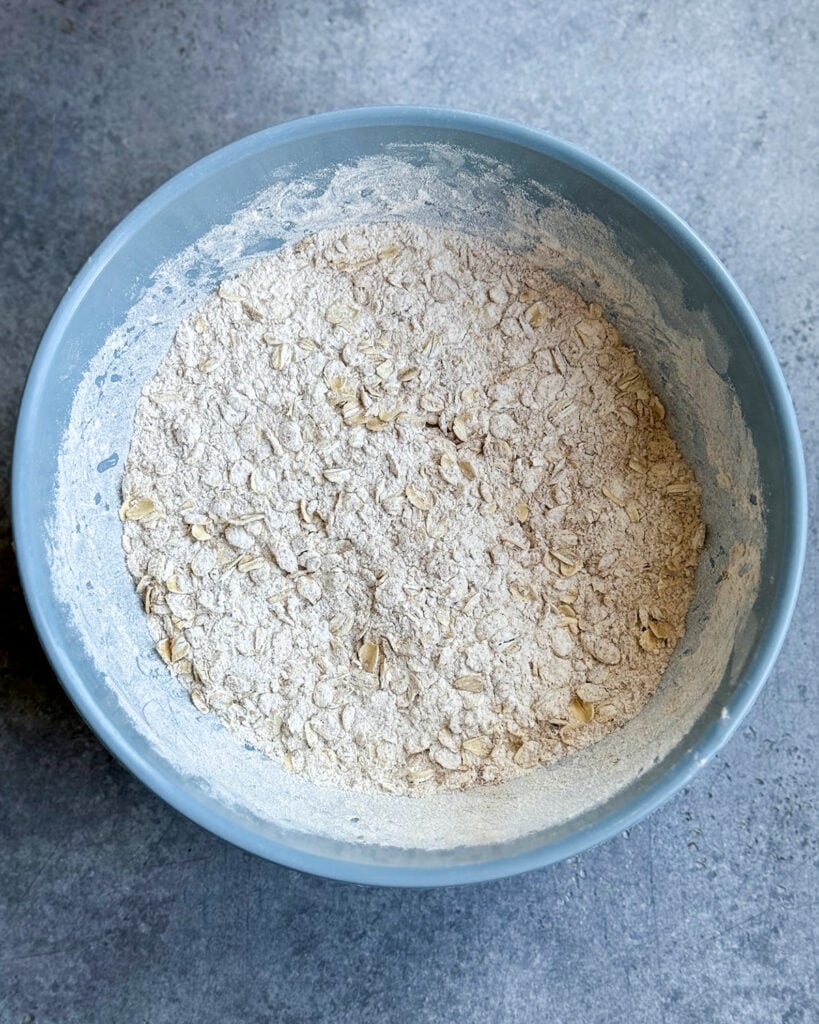 A bowl of flour, mixed with oats.