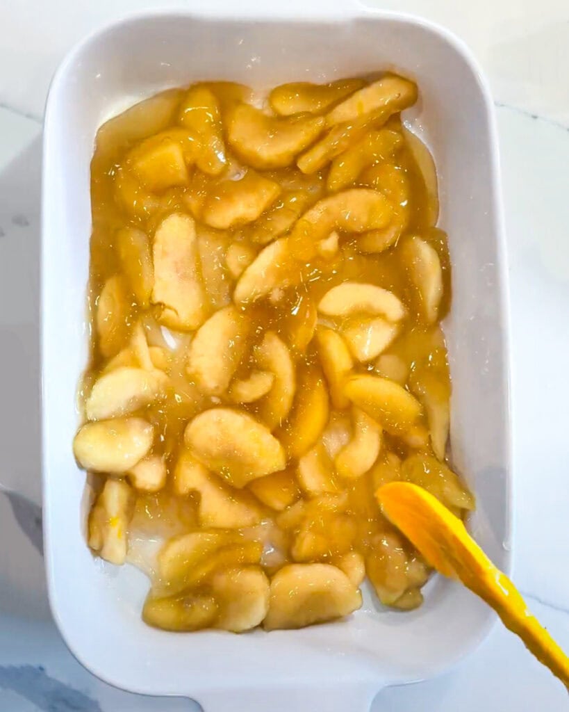 Apple pie filling in a baking pan. 