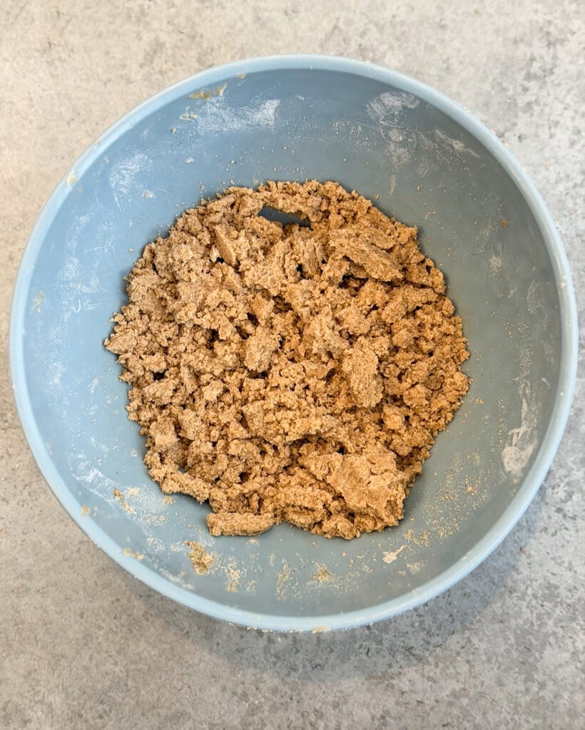 A bowl of unbaked crumb topping. 