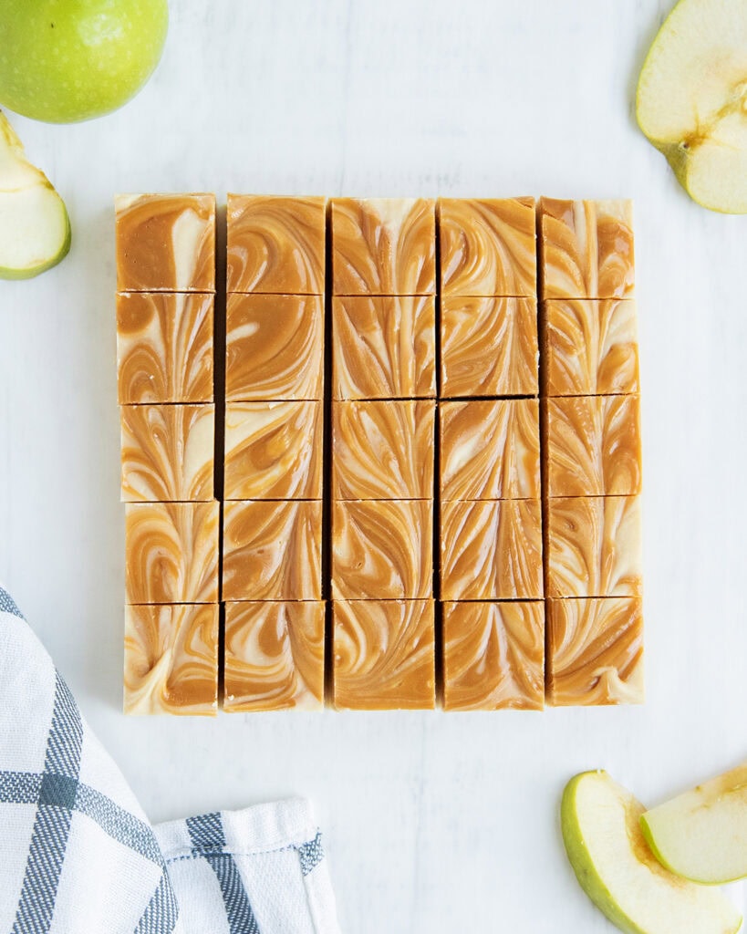 An above view of caramel apple cider fudge pieces showing the caramel swirled on top.