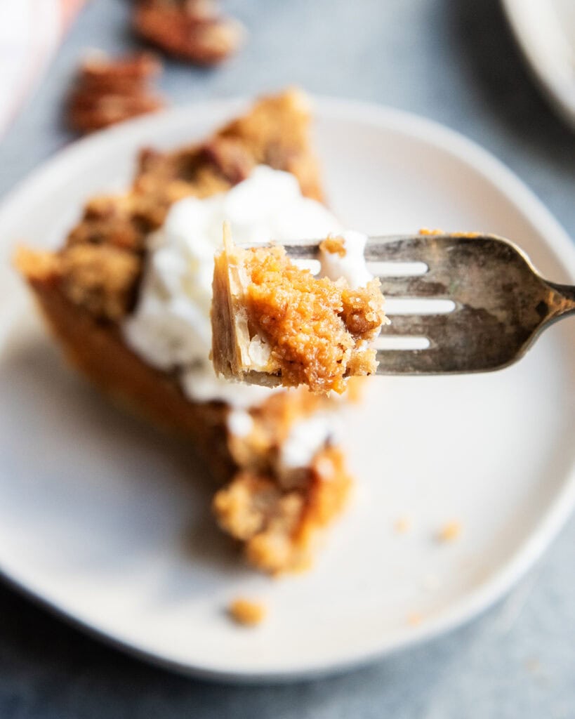 A forkful of sweet potato pecan pie.