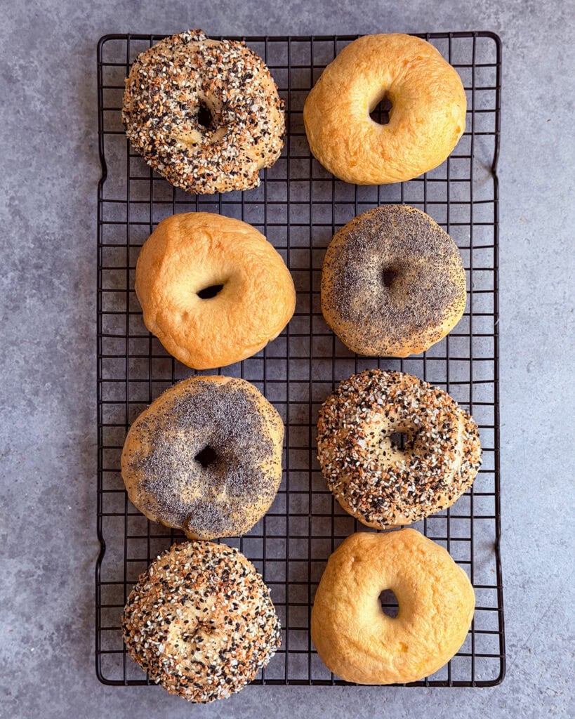 Bagels on a wire rack.