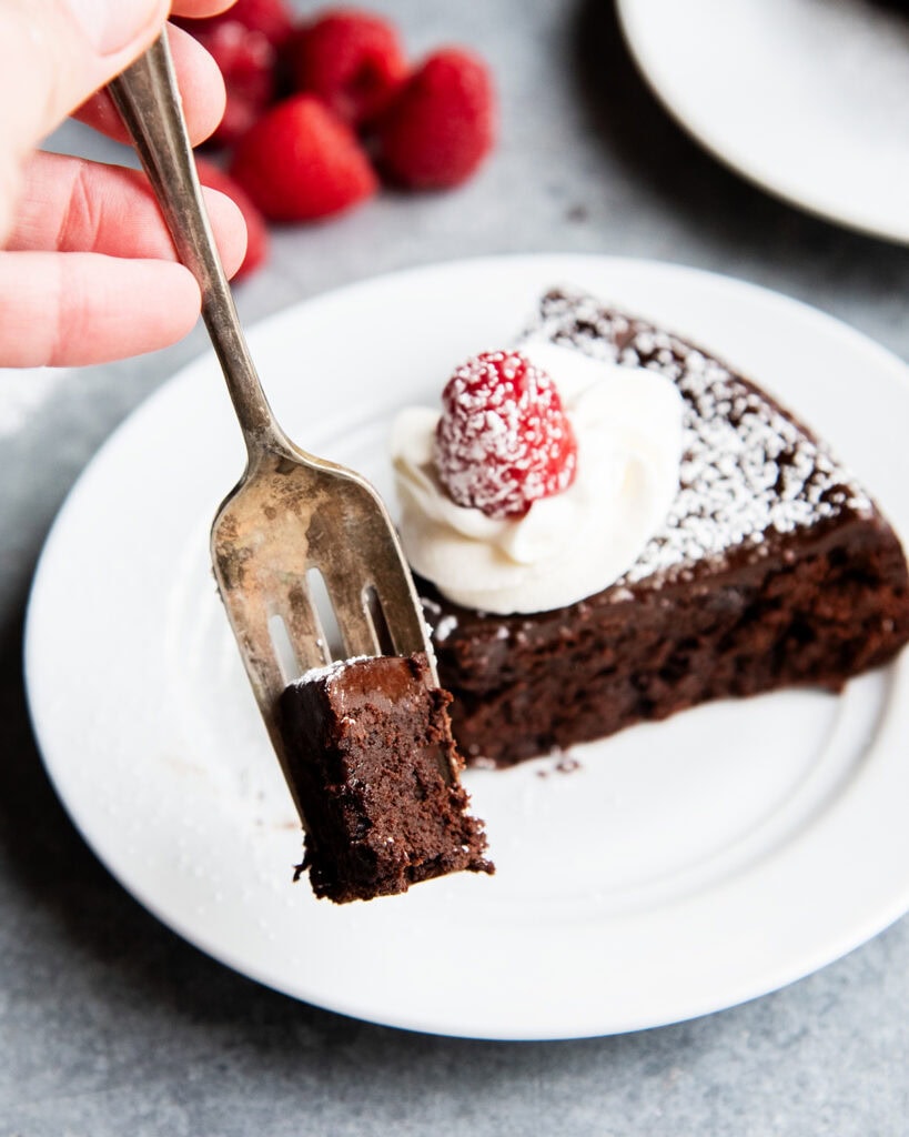 A forkful of flourless chocolate cake.