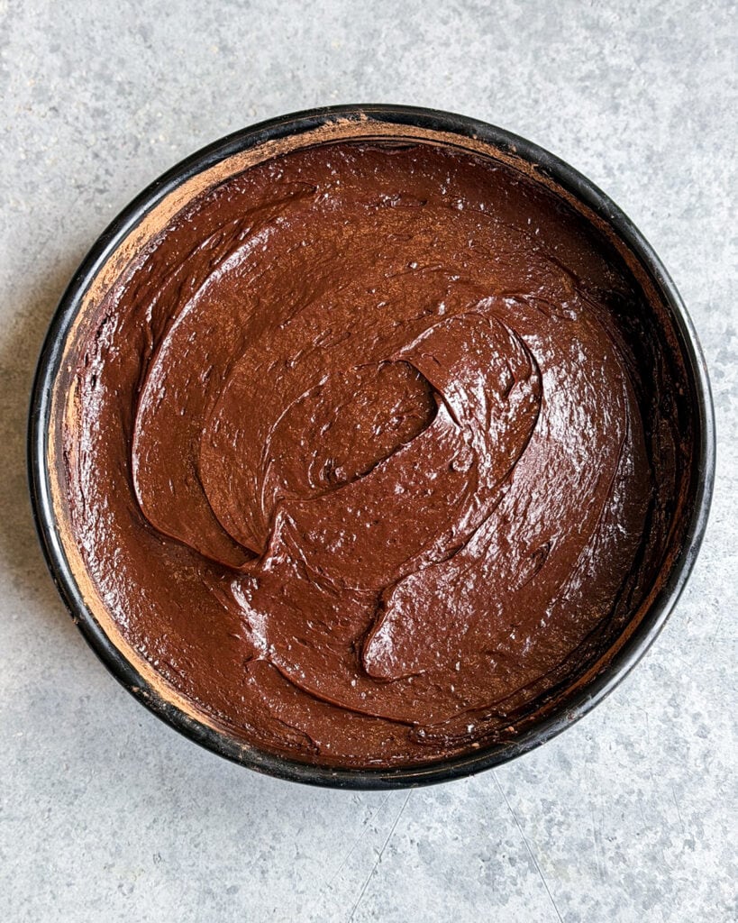 Flourless chocolate cake batter in a pan.