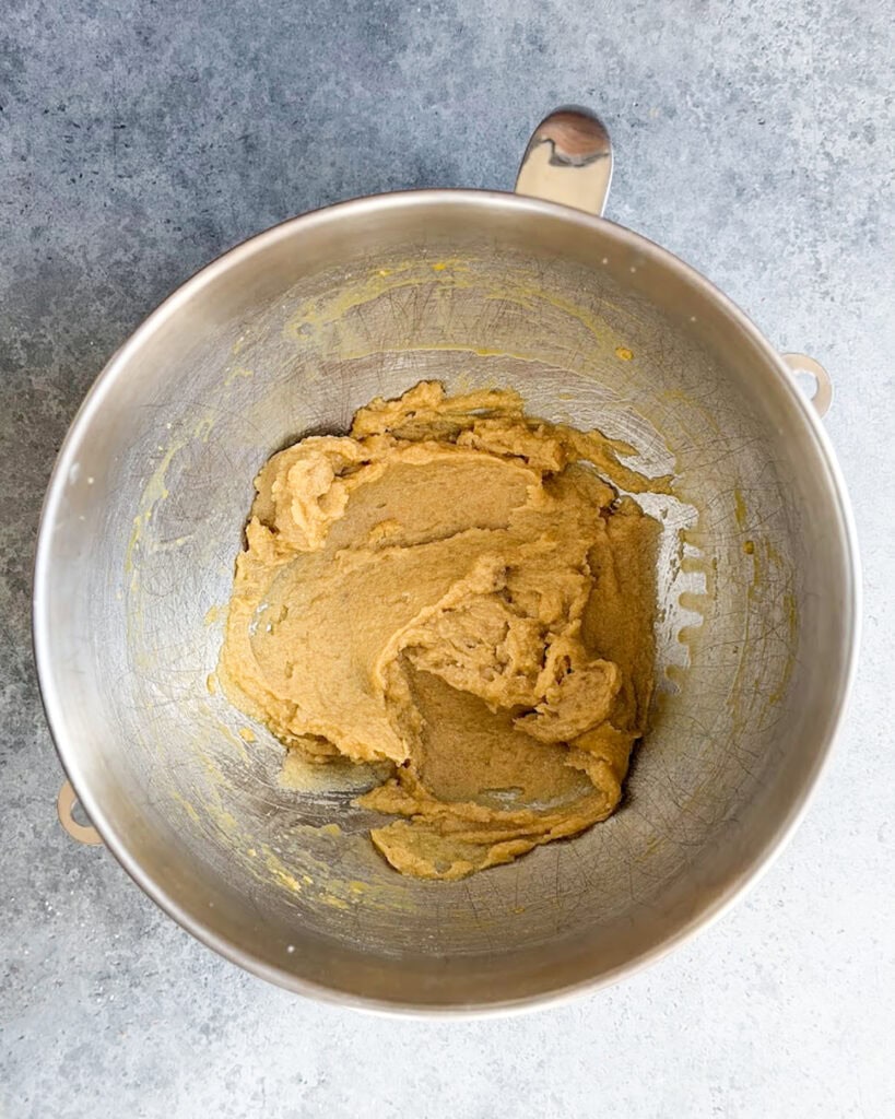 Creamed butter and sugars in a bowl.