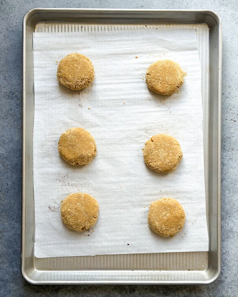 Cookie dough balls on a cookie sheet.